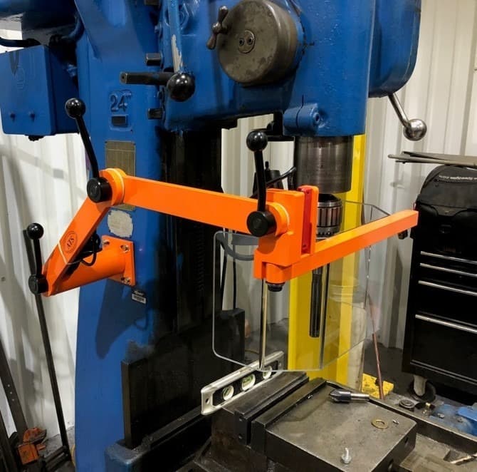 24-inch drill press with orange chuck guard and clear chip shield