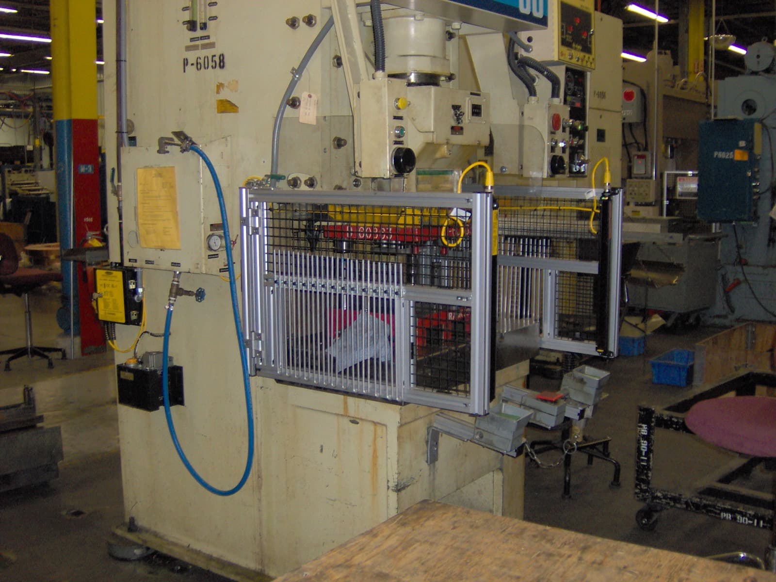 Punch press P-6058 with full mesh perimeter guarding at the work area