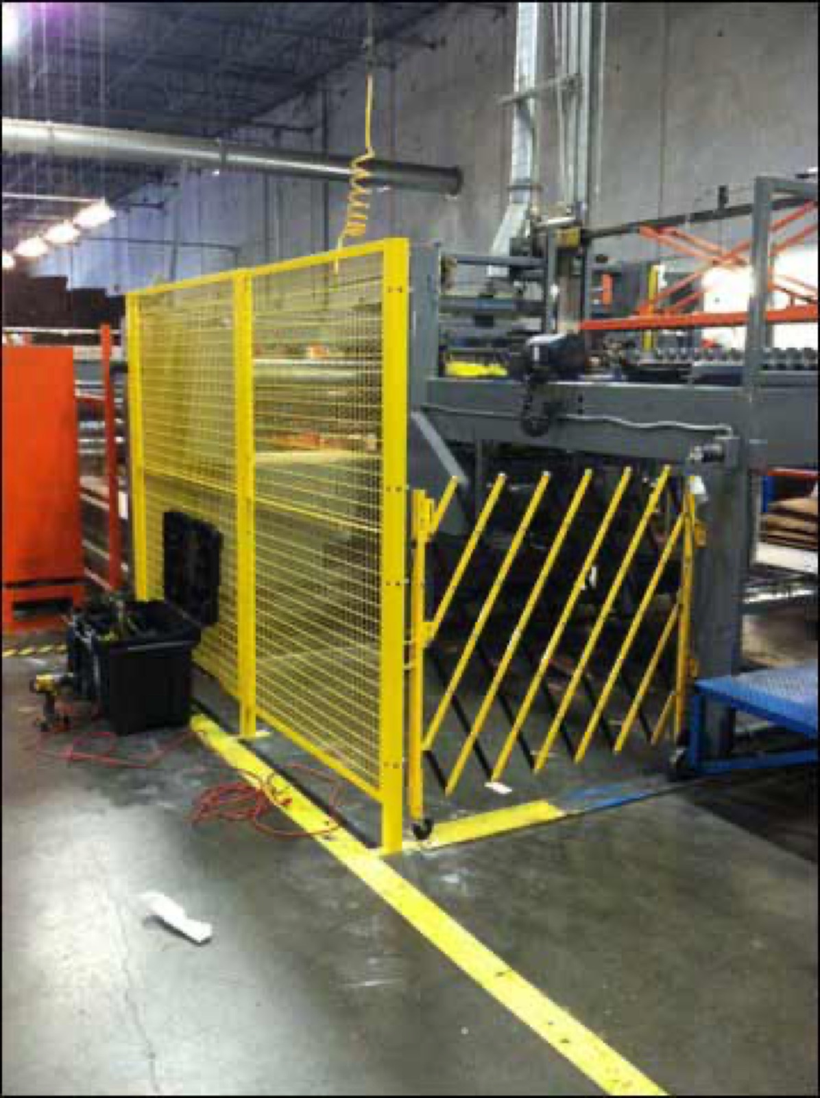 Yellow scissor gate and perimeter fencing