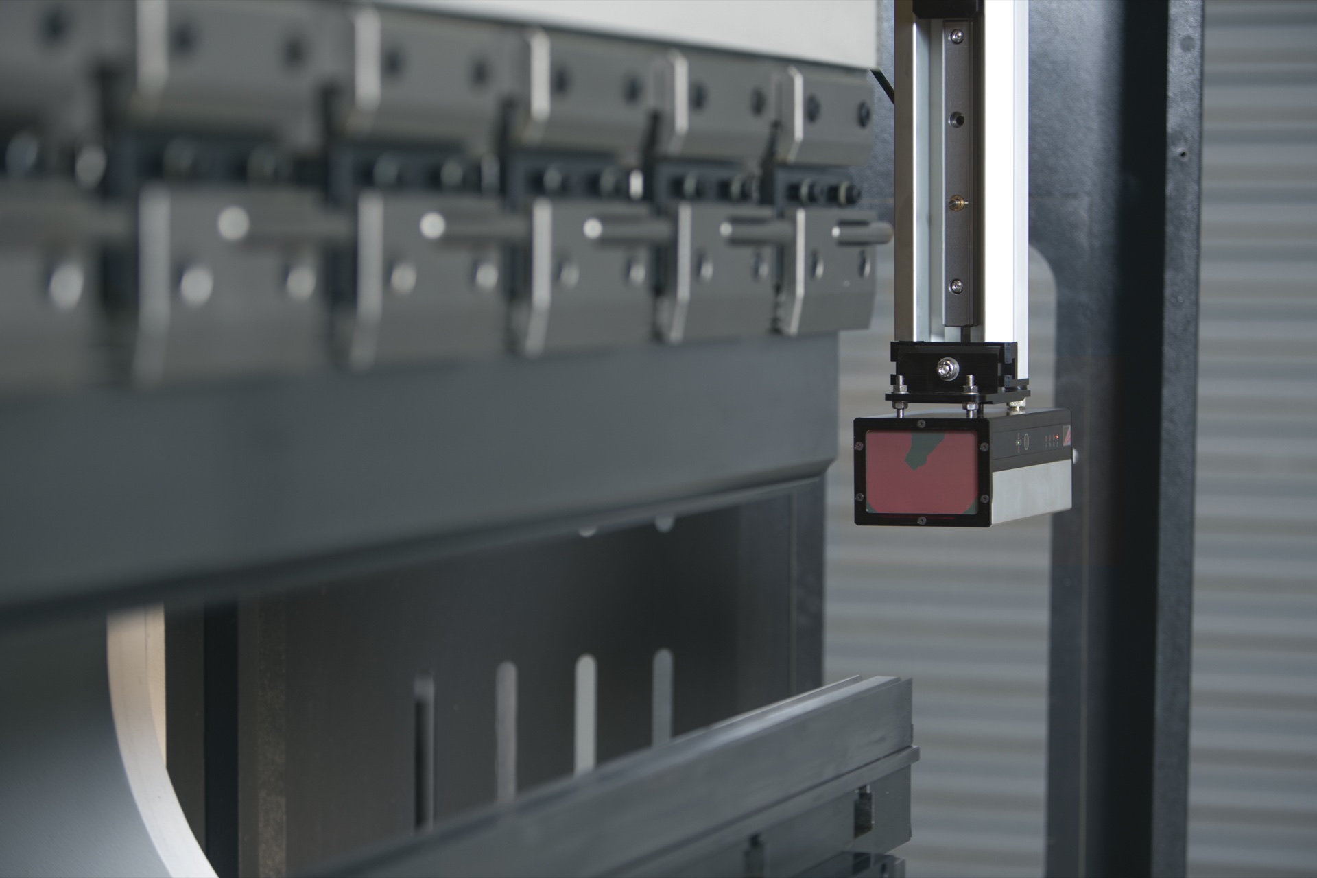 Lazer Safe Sentinel transmitter sensor module mounted on a press brake